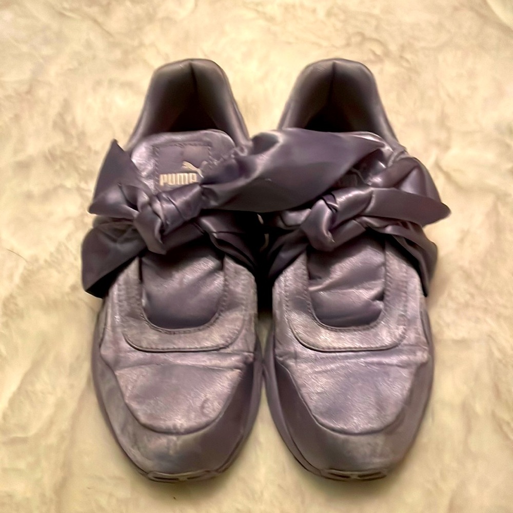 Purple Rihanna sneakers with bow